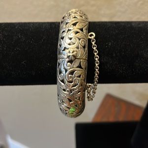 Sterling Silver bangle bracelet with safety chain.